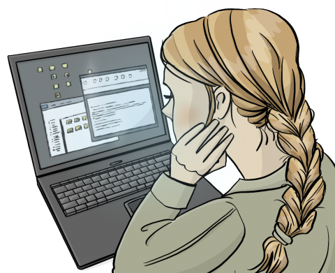 Eine Frau sitzt vor einem Laptop und arbeitet.